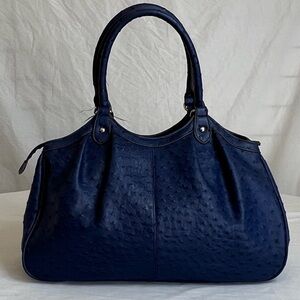Leather restoration on 1/19/26;



 Bright navy blue shoulder bag